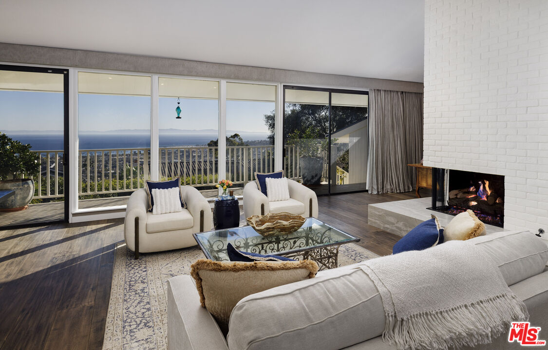 624 Las Alturas Road Santa Barbara, CA 93103 - Photo 2 of 22 a living room with furniture and a large window