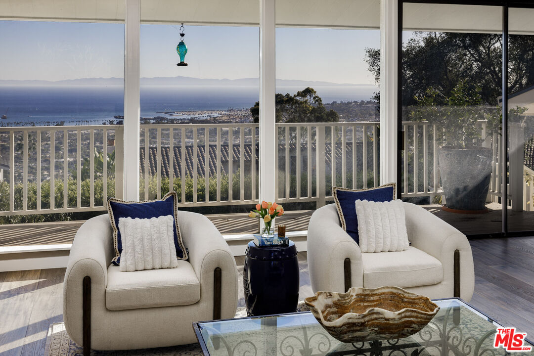 624 Las Alturas Road Santa Barbara, CA 93103 - Photo 4 of 22 a living room with furniture and a floor to ceiling window