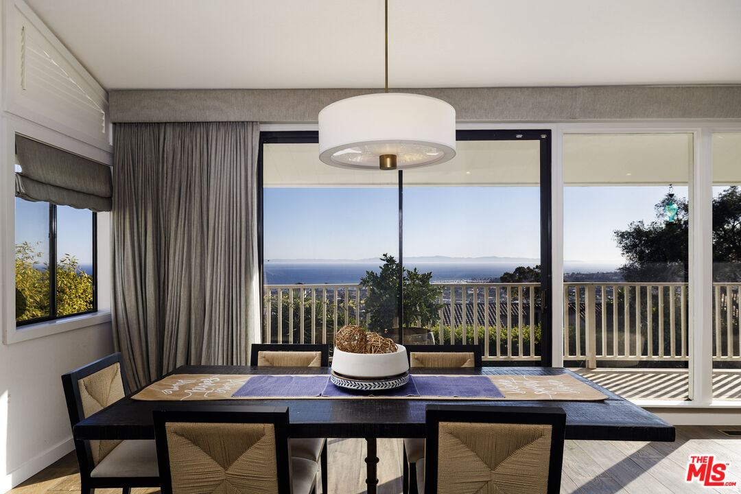 624 Las Alturas Road Santa Barbara, CA 93103 - Photo 7 of 22 a view of a dining room with furniture window and wooden floor