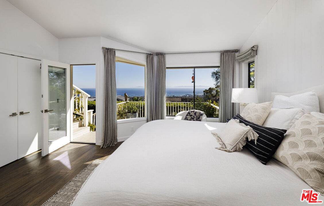 624 Las Alturas Road Santa Barbara, CA 93103 - Photo 10 of 22 a spacious bedroom with a bed and a large window