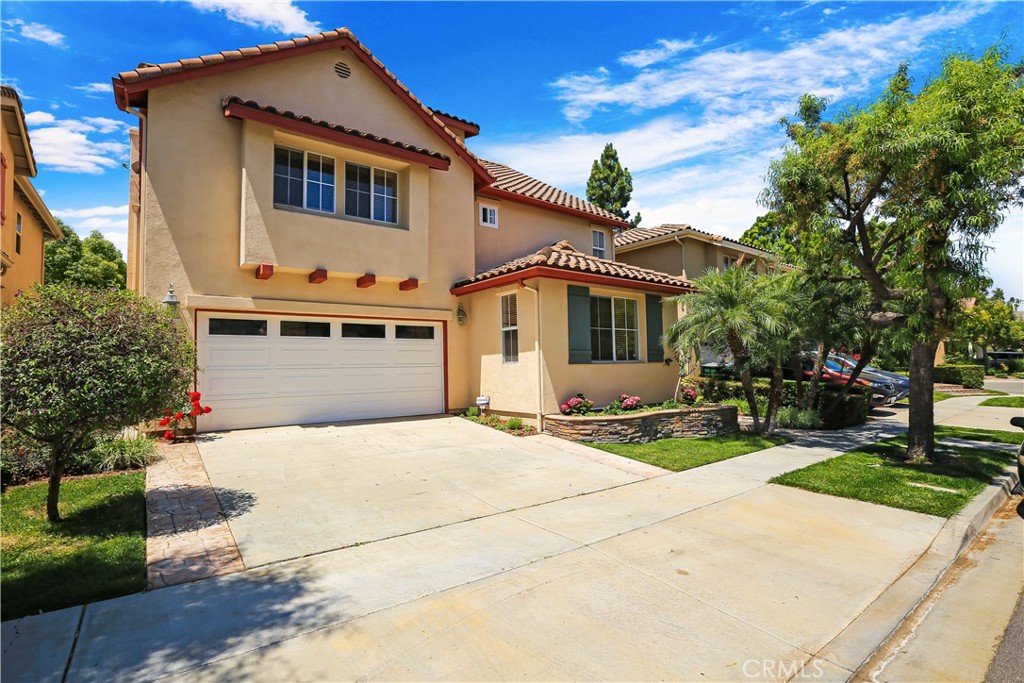 14 Ravendale Irvine, CA 92602 - Photo 13 of 13 a front view of a house with a yard and garage