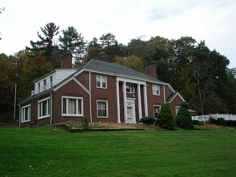 Exterior Front. All brick home sits on 3 acres for family gatherings with a 3 car garage.