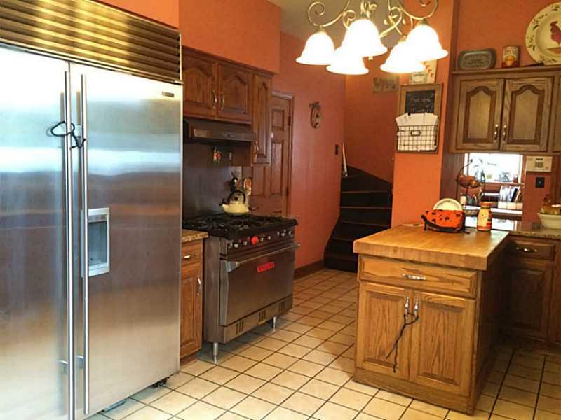 Kitchen. Kitchen has stainless appliances with movable center island.