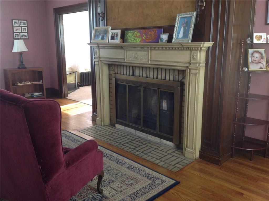 321 Thompson Run Road Pittsburgh, PA 15237 - Photo 8 of 24 Living Room: Two way gas fireplace warms the living room and family room on the other side.