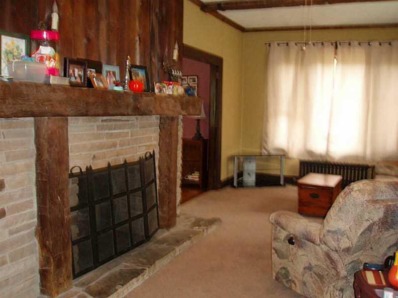 321 Thompson Run Road Pittsburgh, PA 15237 - Photo 10 of 24 Family Room. Stone & wood fireplace compliments the family room.