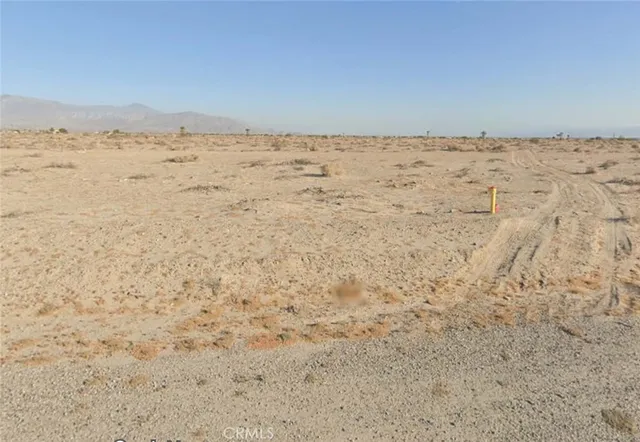 a view of beach and an ocean