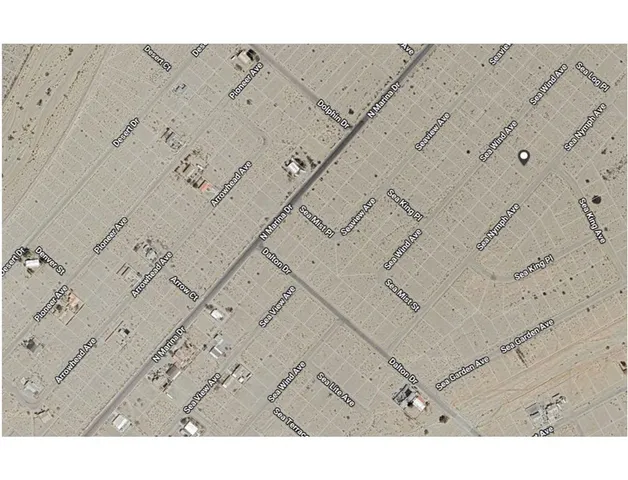 a black and white photo of a beach