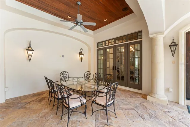 a view of a dining room with furniture and window