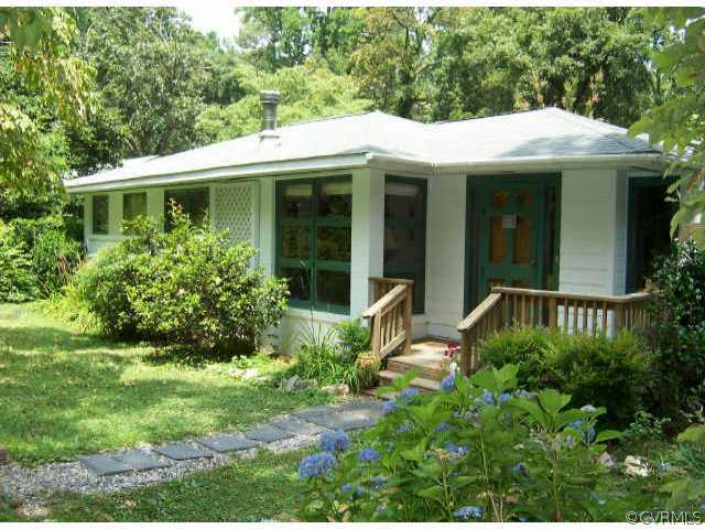 8830 Elm Road Richmond, VA 23235 - Photo 1 of 1 a view of a house with a yard and potted plants