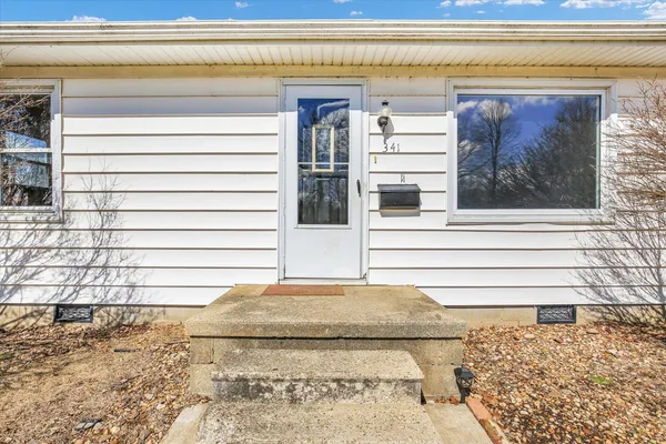a view of a entryway door front of a house