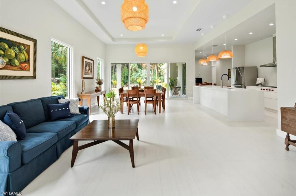 3740 3rd Avenue Southwest Naples, FL 34117 - Photo 3 of 16 Living area with a tray ceiling and recessed lighting