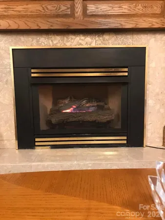 a stove top oven sitting inside of a kitchen