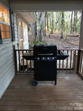 a room with wooden floor table and chairs