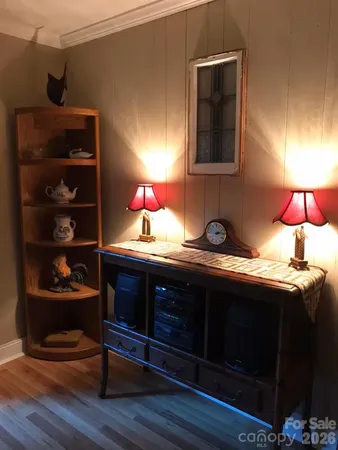 a view of room with cabinets and wooden floor