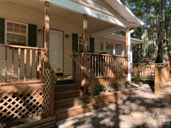 a view of street with wooden fence