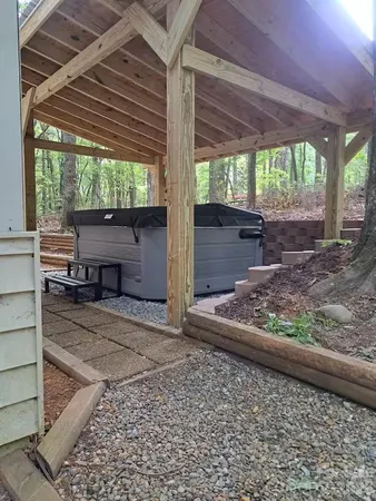 a view of a backyard with wooden floor and roof