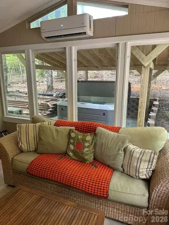 a living room with a couch and a large window