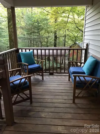 a view of a chairs on wooden deck
