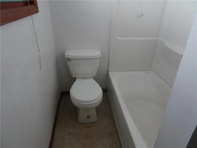 a bathroom with a toilet and a sink
