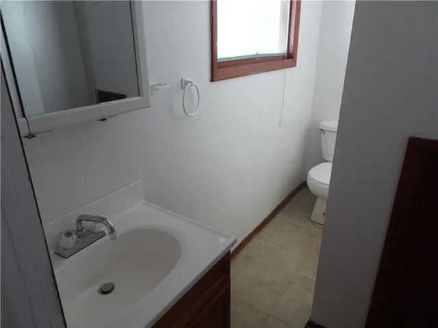 a bathroom with a sink and toilet
