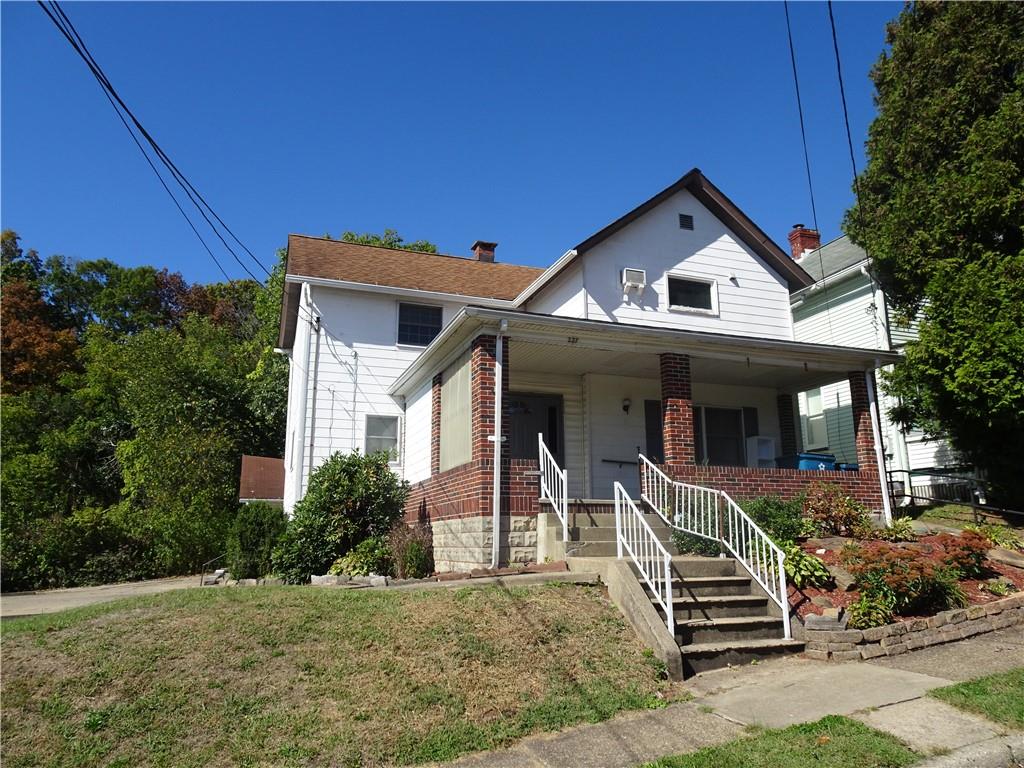 227 South 6th Street Youngwood, PA 15697 - Photo 2 of 27 a front view of a house with a yard