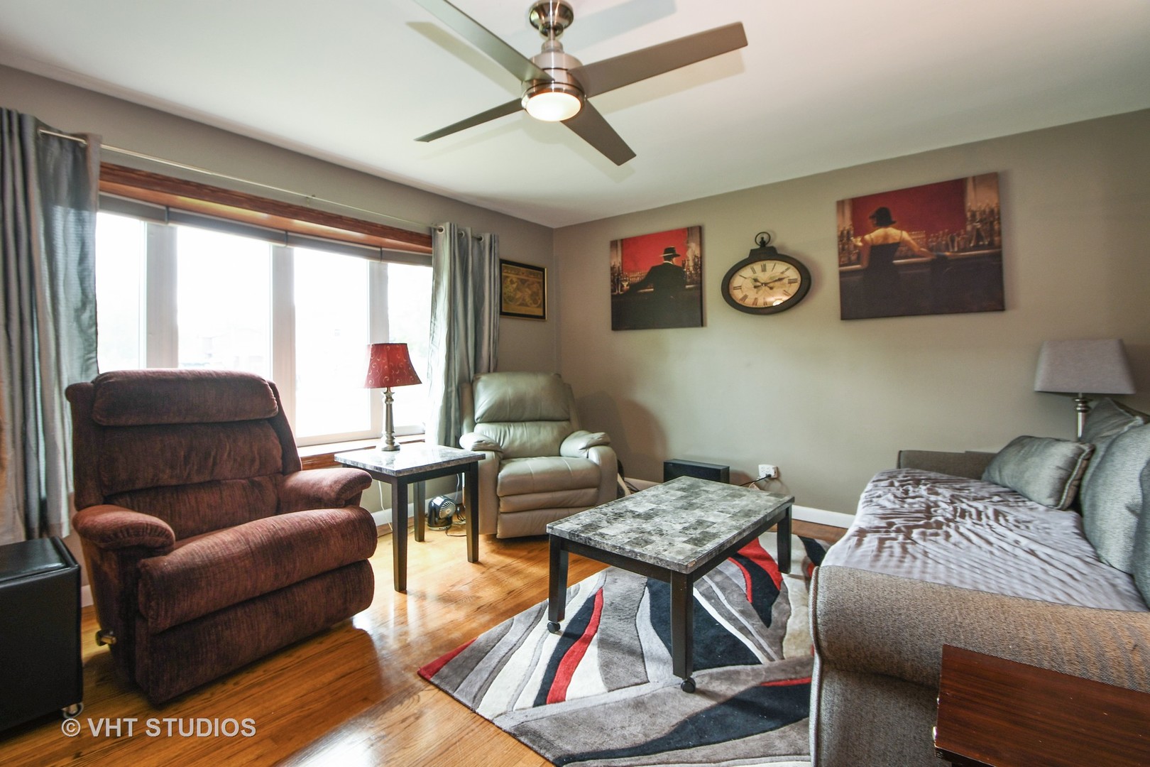 10801 Mayfield Avenue Chicago Ridge, IL 60415 - Photo 2 of 10 a living room with furniture a rug and a large window