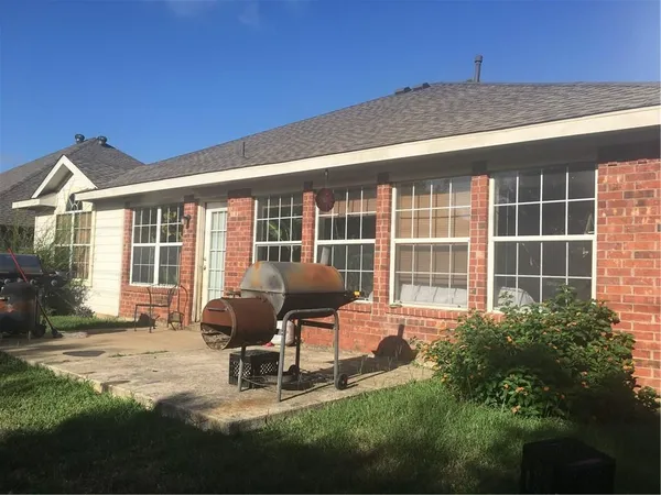 a house view with a garden space
