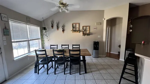 a view of a dining room with furniture and window