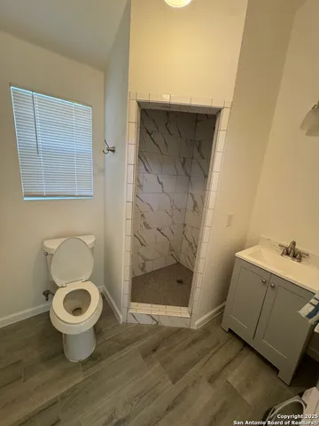 a bathroom with a toilet and a sink