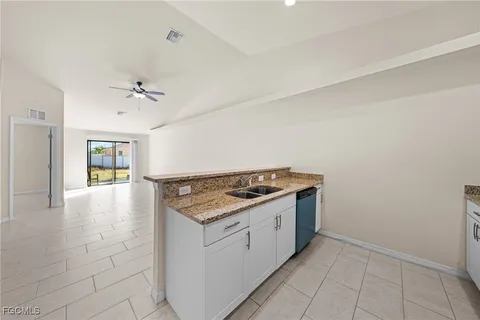a kitchen with a stove and a sink