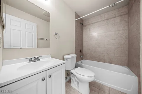 a bathroom with a sink a toilet and a bathtub