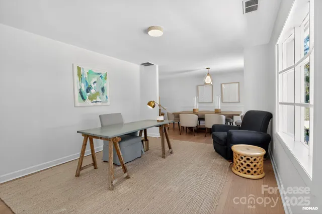 a living room with furniture and a table