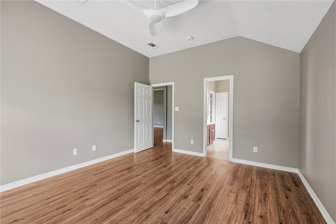 1700 Kingsgate Drive Bryan, TX 77807 - Photo 12 of 21 a view of an empty room with wooden floor