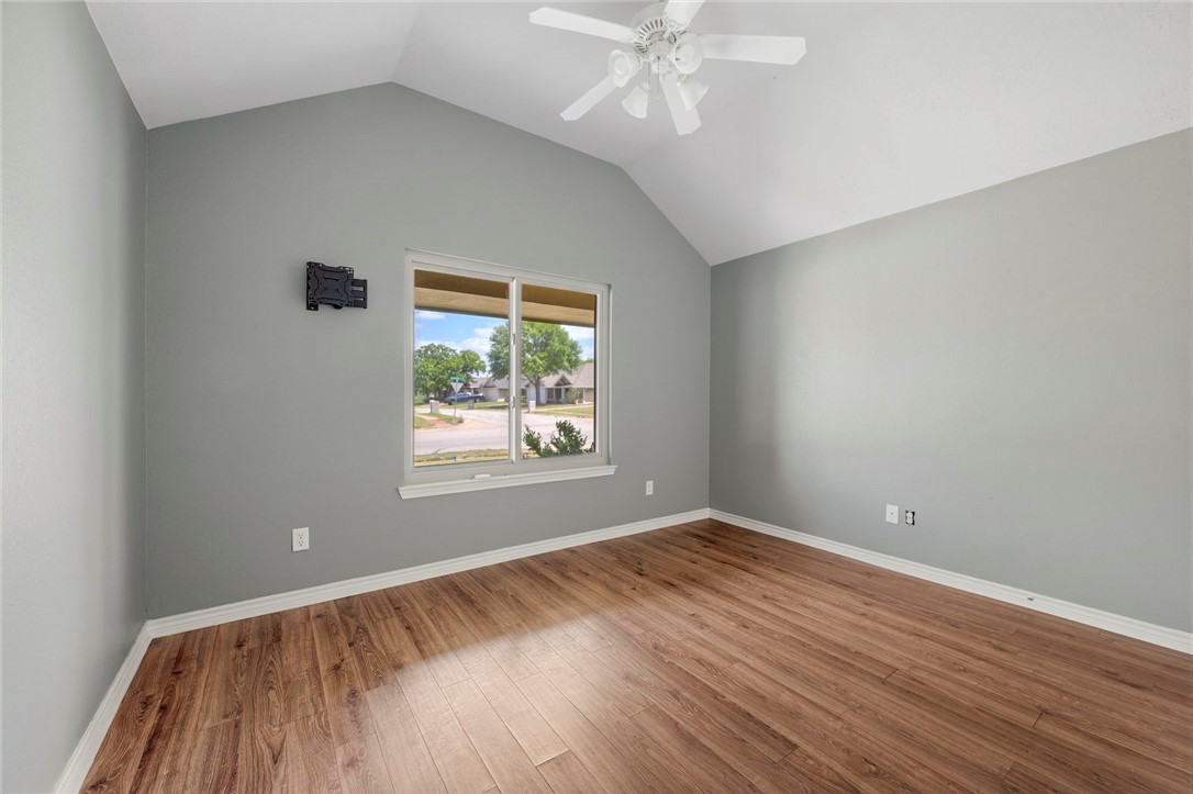 1700 Kingsgate Drive Bryan, TX 77807 - Photo 15 of 21 wooden floor in an empty room with a window
