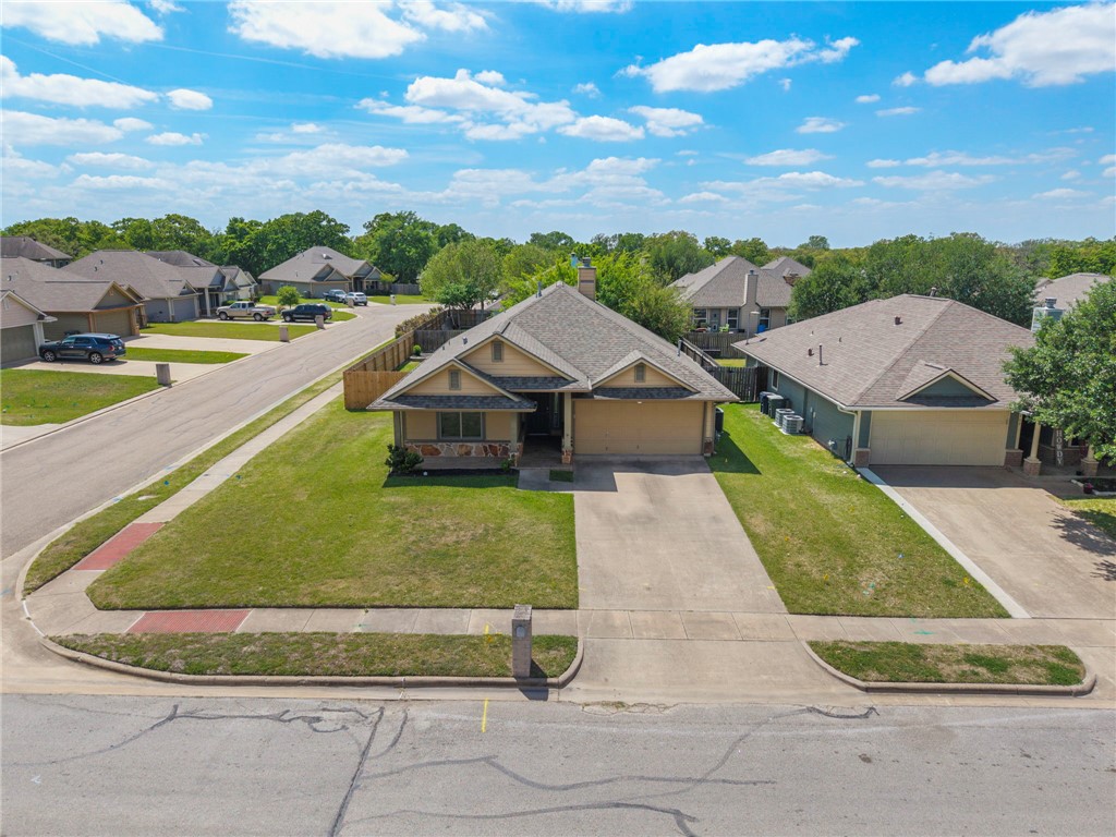 1700 Kingsgate Drive Bryan, TX 77807 - Photo 2 of 21 a view of a house with a swimming pool