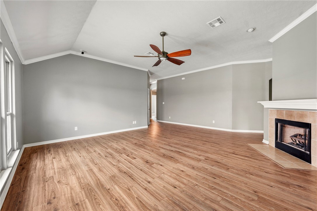 1700 Kingsgate Drive Bryan, TX 77807 - Photo 6 of 21 wooden floor in an empty room with a window
