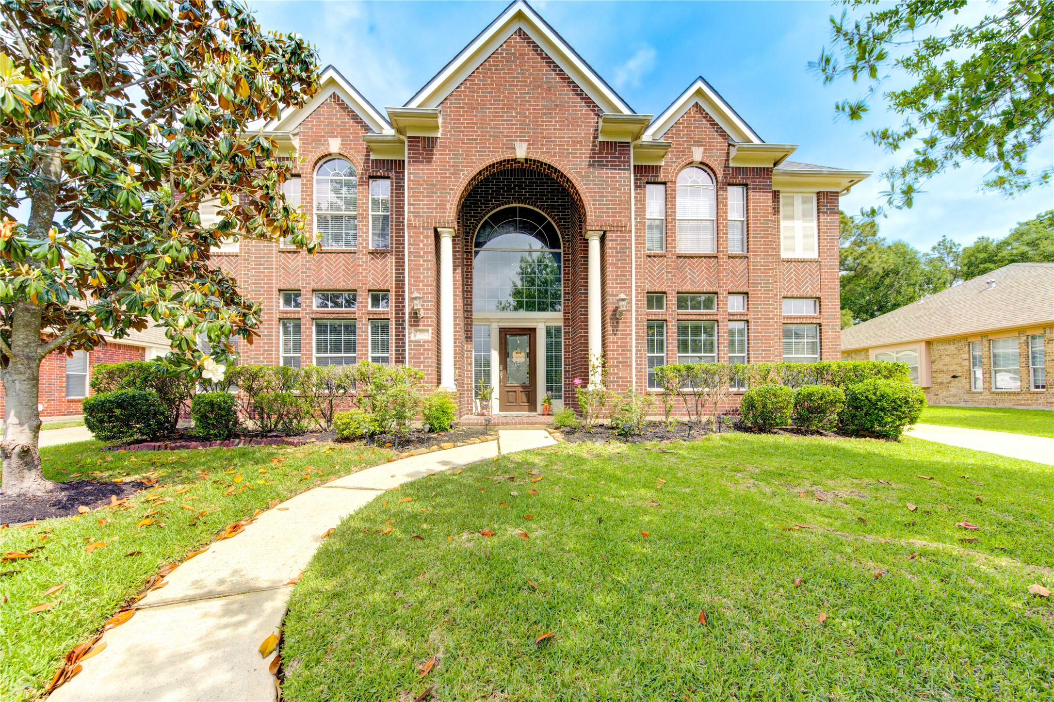 a front view of a house with garden