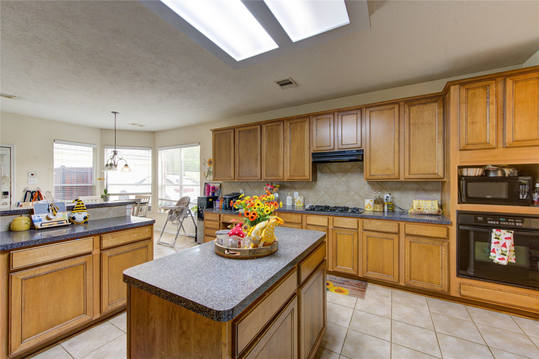 24811 Corbin Gate Drive Spring, TX 77389 - Photo 11 of 32 a kitchen with lots of counter top space and appliances
