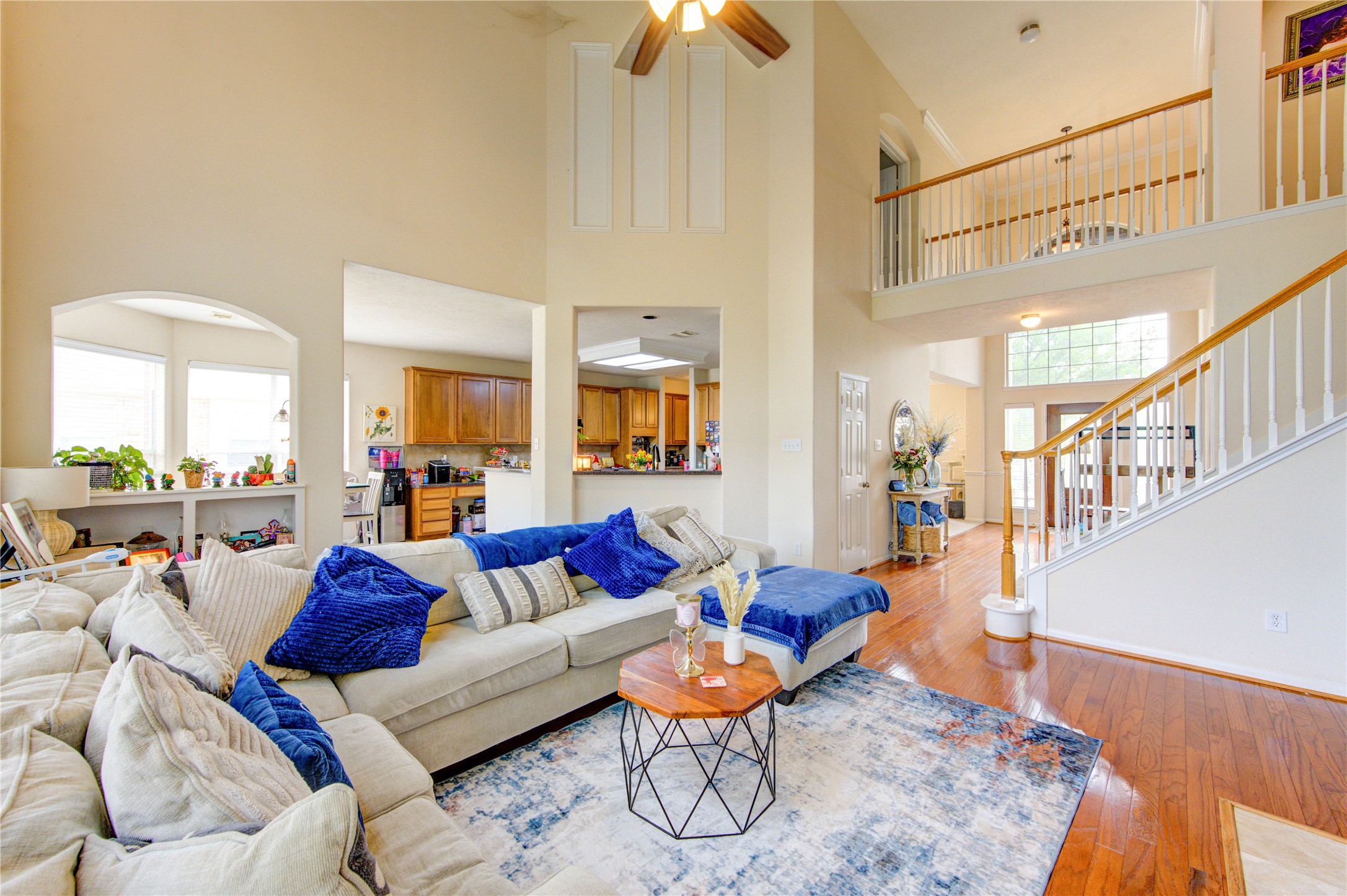 24811 Corbin Gate Drive Spring, TX 77389 - Photo 31 of 32 a living room with furniture and a chandelier