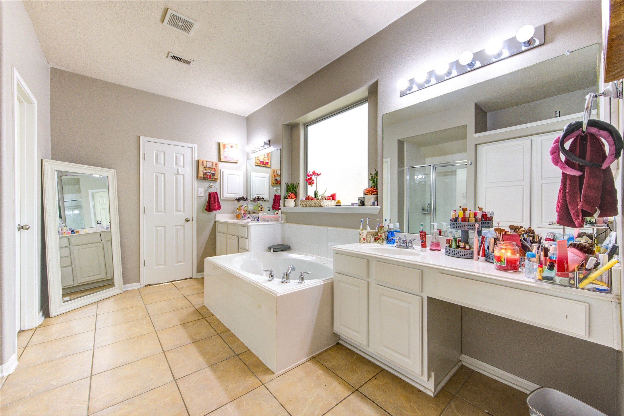 24811 Corbin Gate Drive Spring, TX 77389 - Photo 21 of 32 a bathroom with a sink mirror and vanity