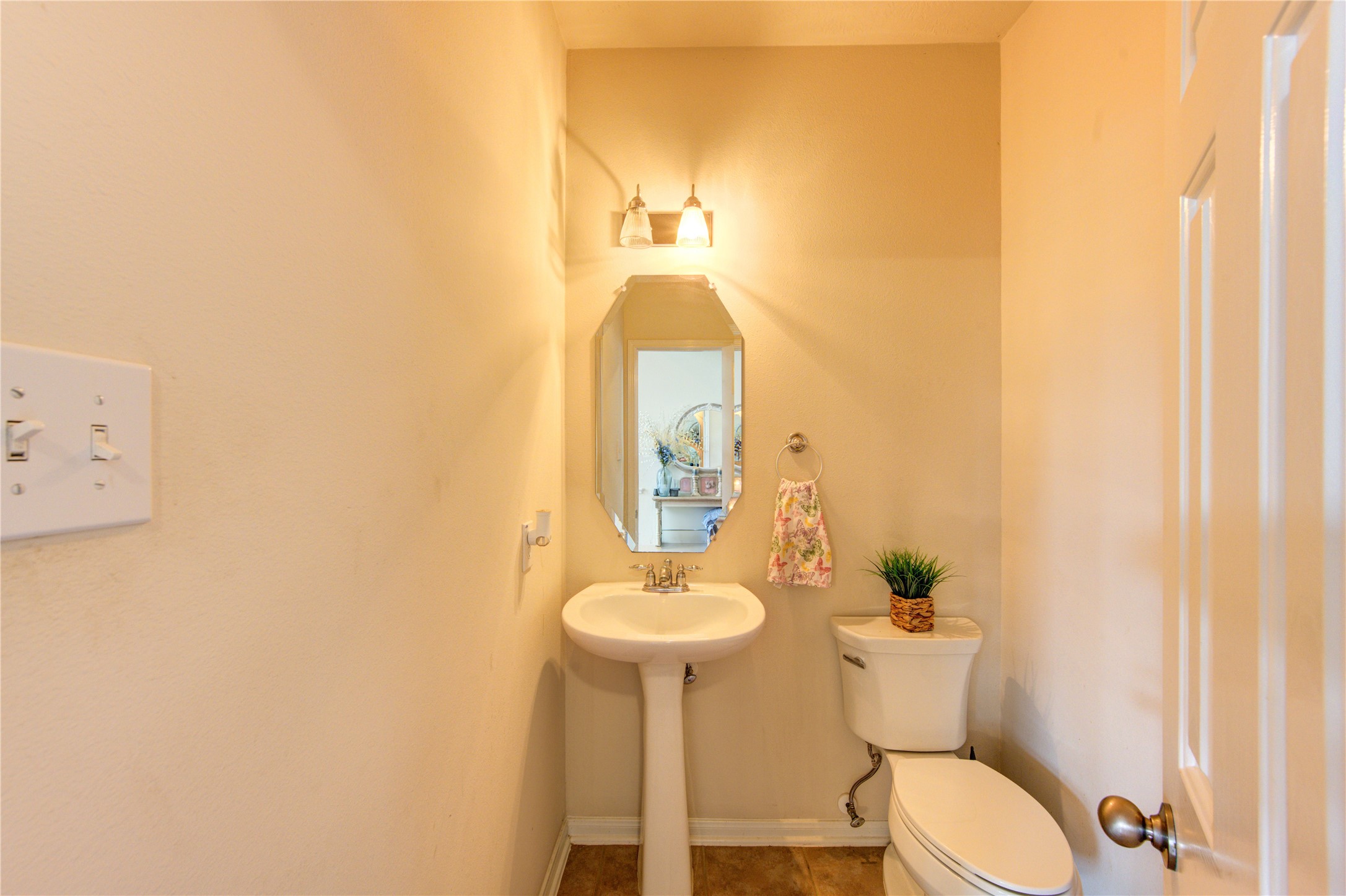 24811 Corbin Gate Drive Spring, TX 77389 - Photo 22 of 32 a bathroom with a toilet a sink and mirror