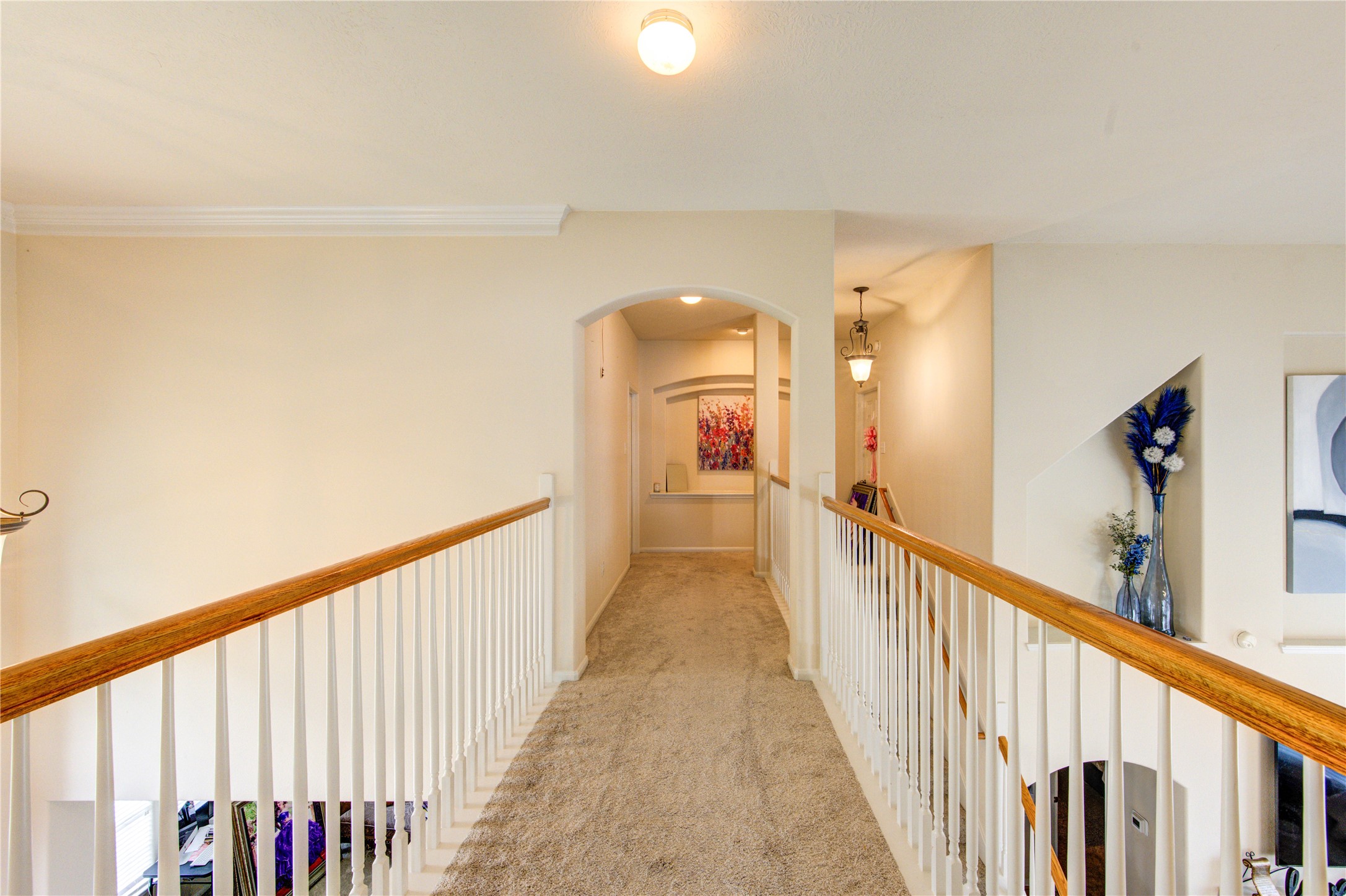 24811 Corbin Gate Drive Spring, TX 77389 - Photo 23 of 32 a view of a hallway with wooden floor and staircase