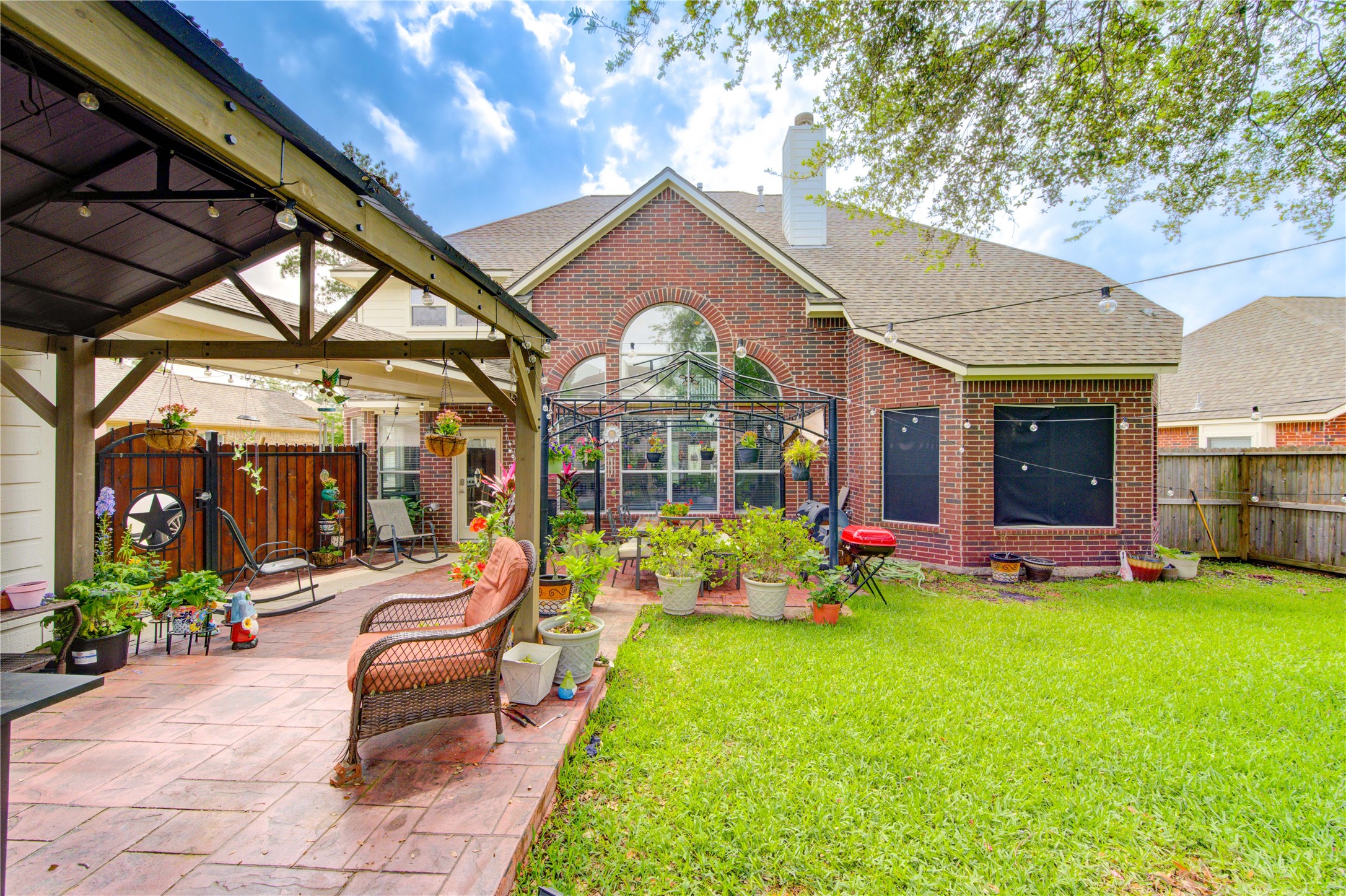 24811 Corbin Gate Drive Spring, TX 77389 - Photo 4 of 32 a view of a house with backyard porch and sitting area