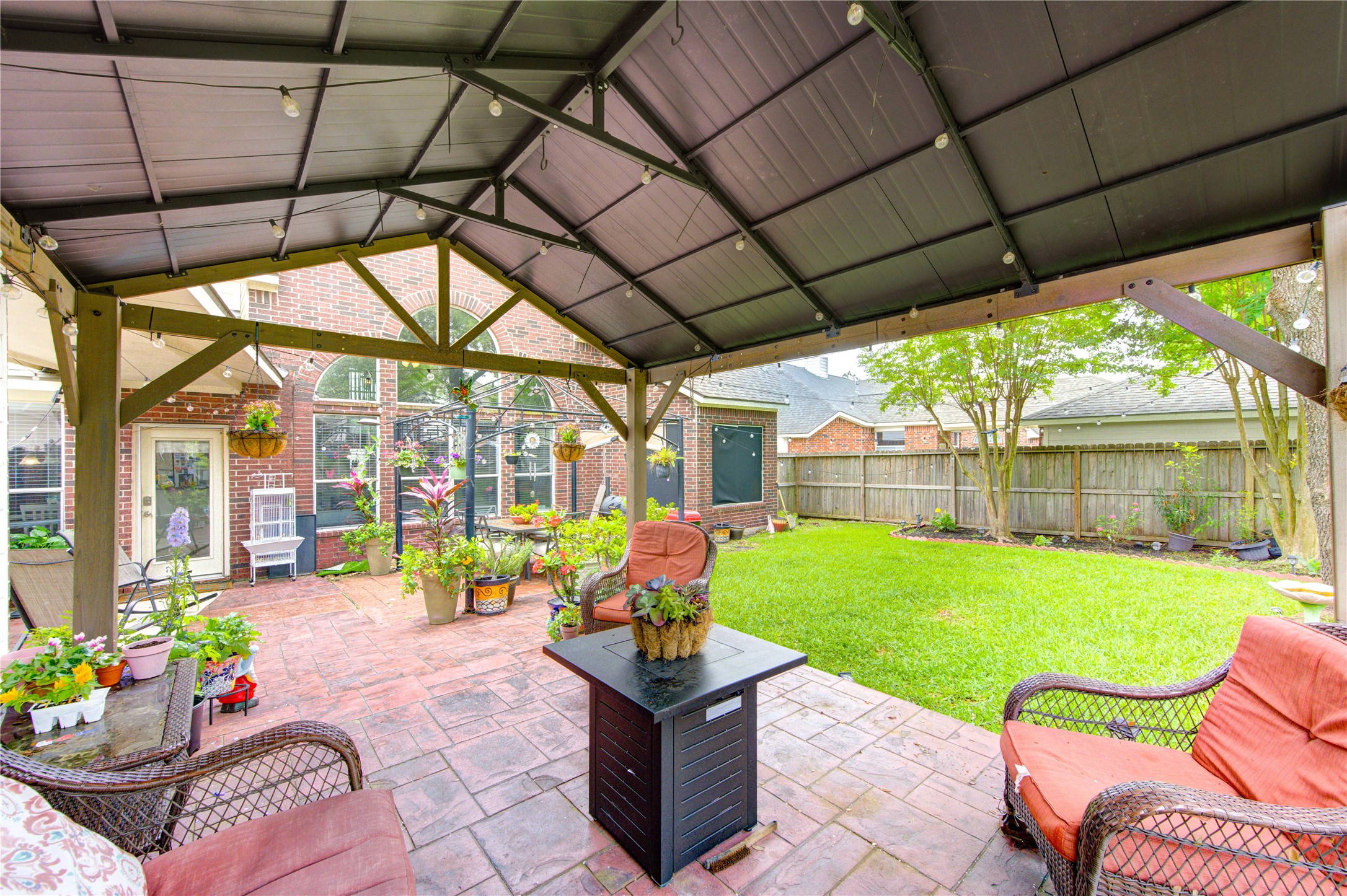 24811 Corbin Gate Drive Spring, TX 77389 - Photo 5 of 32 a building outdoor space with furniture and garden view
