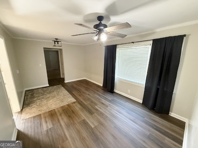 451 Lambs Bridge Road Swainsboro, GA 30401 - Photo 6 of 23 a view of a livingroom with wooden floor and a ceiling fan