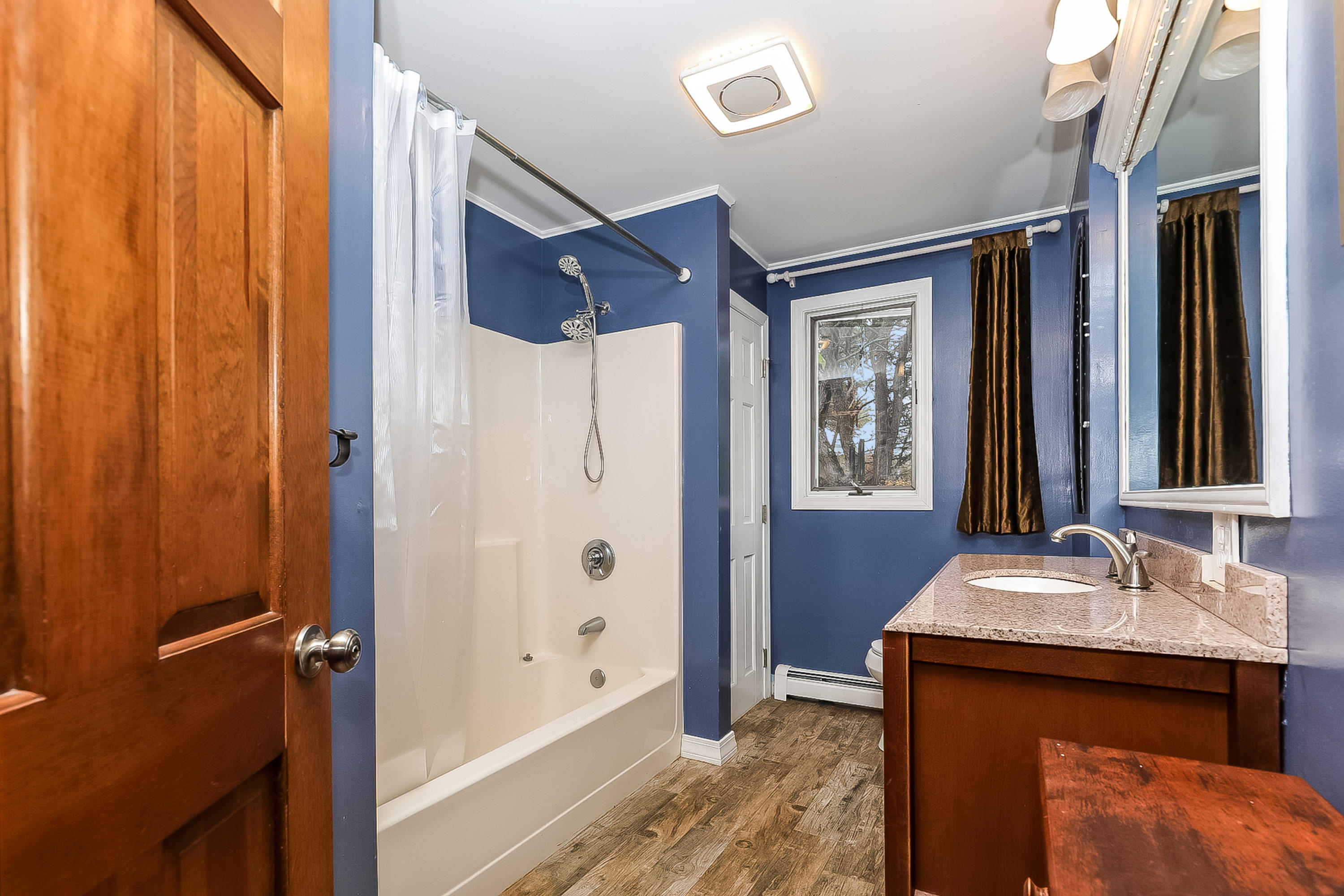 136 Shore Road Truro, MA 02666 - Photo 8 of 21 a bathroom with a sink and a mirror