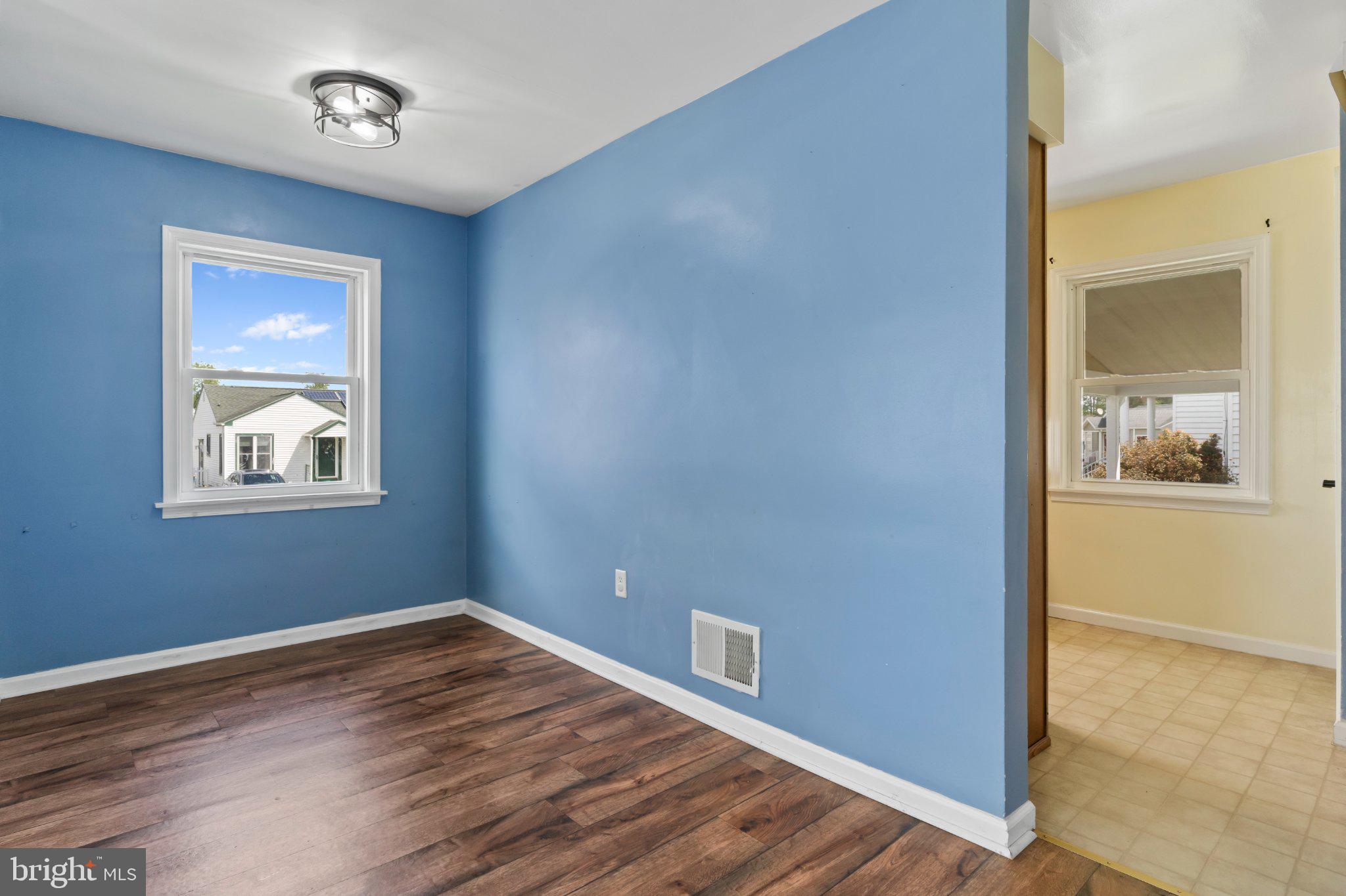 1303 Kingsley Road Camp Hill, PA 17011 - Photo 4 of 21 Bright and airy room with blue walls.