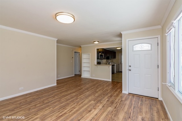 170 George Road Wheeling, IL 60090 - Photo 3 of 11 a view of a kitchen with wooden floor and a sink