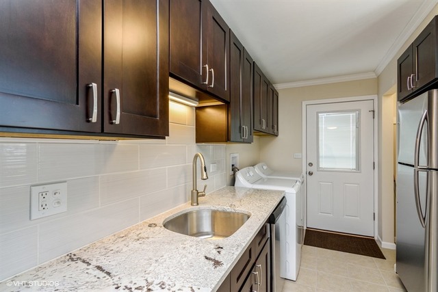170 George Road Wheeling, IL 60090 - Photo 5 of 11 a kitchen with a sink and a refrigerator