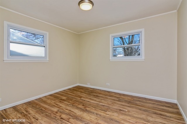 170 George Road Wheeling, IL 60090 - Photo 7 of 11 a view of empty room with wooden floor